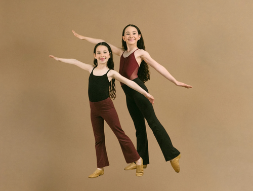Two dancers posing together in the studio